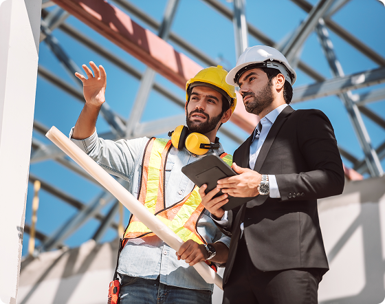 HVAC installers working on equipment installation.